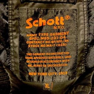 Schott n.y.c spec m85-237-04. Waxed denim.  Flawless.